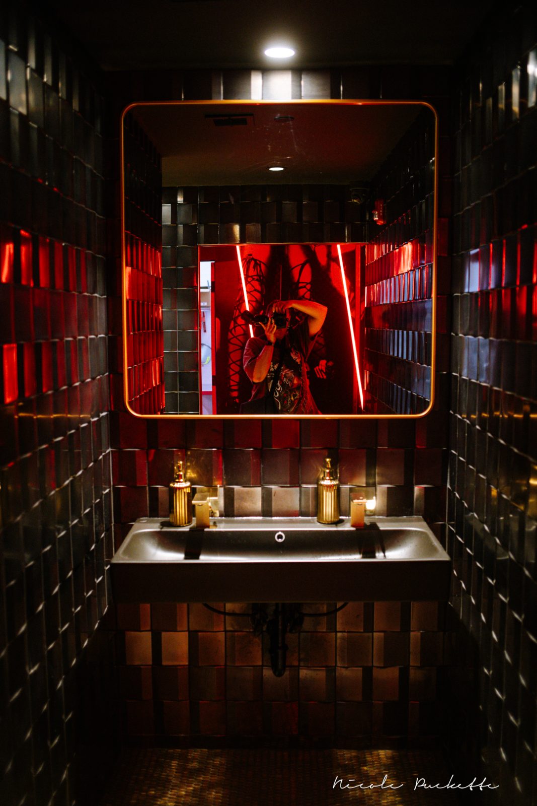 Partake NYC red tiled restroom